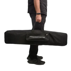 کیف حمل تخت خواب تاشو هپی کمپ در دست یک نفر